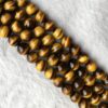 Shop 8mm Natural Tiger Eye Smooth Round Beads