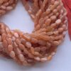 Natural Peach Moonstone Smooth Oval Beads Strand